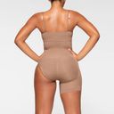 SKIMS  Seamless Sculpt Solution Short Left Leg Exposed Sienna Size Medium Photo 3