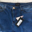 Pretty Little Thing  Khloe Extreme rip Women’s Skinny Jeans in Medium wash size 10 Photo 3