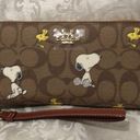 Coach  X Peanuts Long Zip Around Wallet In Signature Canvas Snoopy Woodstock Photo 0