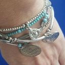 Stacked charm bracelets peace love harmony Photo 0