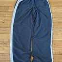 Nike 𝅺 grey pink and white lined track pants size L (12-14) Photo 0