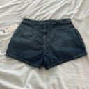 Urban Outfitters denim skort Size 26 Condition: NWT  Color: Blue   Details : - Button down front  - Hidden button and zipper closure  - Comfy  Extras: -  I ship between 1-2 days  Photo 4