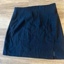 Short black pencil skirt with small slit Size M Photo 0