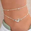 Layered dolphin anklet Photo 0