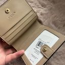 Coach Snap Wallet In Signature Canvas With Heart Print Photo 10