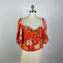 Free People  Mirabella Floral Wrap Front Blouse Photo 1