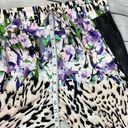 Bebe  Floral Animal print blend joggers with faux leather side pockets. Size M Photo 6