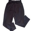 Lulus Lulu’s black ruffle hem ribbon tie pants women’s size large Photo 0