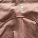 Under Armour -BLUSH COLOR LEGGINGS-SIZE XS Blush pink athletic leggings, has back pocket, drawstring waist, excellent condition  Measurements: Waist: side to side 12-14 inches  Inseam: 17 inches Photo 7