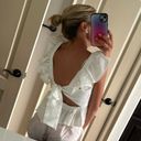 Francesca's white ruffle top Photo 1