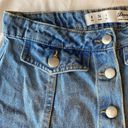 Buttons Jean mini skirt with  down the front. Photo 2