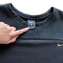 Nike -Women's Long Sleeve Therma Icon Clash Fleece Crew Top Black/Gold Size XL Photo 4