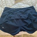 Lululemon Speed Up Mid-Rise Lined Short 4" in Navy in size 6 Photo 1