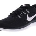 Nike Women's Flex 2017 Black / White Running Sneaker Photo 0