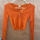 Garage Cropped Orange Long Sleeve Photo 0