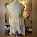 Shyanne  knit & crochet high low t-back cream colored vest. Photo 1