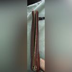 Coach  Corner Zip Wristlet in the color 1941 Red with Horse and Carriage print. Photo 4