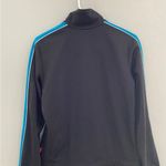 Puma Women’s vintage track jacket medium
Black zip up with blue stripe Photo 4