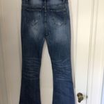 Women’s Medium Wash MidRise Slight Distress Babybell Jeans sz medium Blue Photo 4