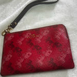Coach  Corner Zip Wristlet in the color 1941 Red with Horse and Carriage print. Photo 0