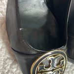 Tory Burch Black and Gold Chunky Heel Pumps with Gold Ornament Photo 6