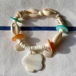 painted seashell and puka shell bracelet with charms Photo 3