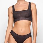 SKIMS Soft Smoothing Seamless Lurex Bralette Eclipse
Size XS Photo 0