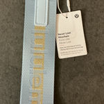 Lululemon  Athletica Light Blue and Gold Never Lost Keychain Photo 0
