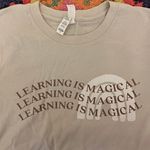 Magic Learning Is  Teacher Tee Photo 0