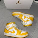 Nike Jordan Women’s Mid 1 Yellow and White Photo 1