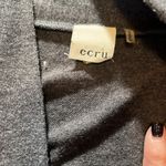 Ecru medium sized long cotton/suede cardigan with front pockets in GUC. Photo 1