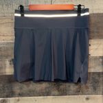 Athleta Ace Black Tennis Skort with silver reflective stripe on waistband Photo 2