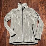 Nike Women’s shimmery grayish charcoal windbreaker Photo 0