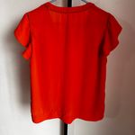 Q&A  orange top size medium Photo 2