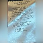 Ann Taylor - Black ruffled shoulders‎ short sleeve blouse 
Size M Photo 6