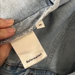 Reformation  distressed denim jacket Photo 5