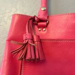 Kate Spade bright coral pink colored tote bag with snap closure and tassels Photo 2