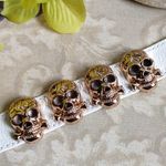 White Leather Stop Bracelet w/ Gold Skulls Photo 1