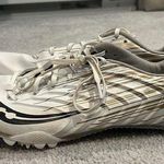 Saucony  size 9.5 white and gold track spikes Photo 0