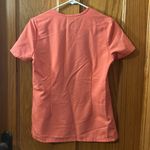 FIGS  Women’s Catarina One Pocket Scrub Top in color Hot Coral Size XS Photo 5