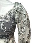 Elegant Floral Lace Blouse in Black and white Photo 2