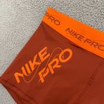 Nike NEW  Pro Dri Fit Mid-Rise Shorts Women XXL Orange 3in GRX Athletic Training Photo 1