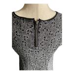 Urban Outfitters -SILENCE + NOISE Adorable black and white fit and glare dress, black tattered gem, short sleeves, back zipper, excellent condition, size small Measurements: Bust: armpit to armpit 16 inches Length: shoulder seam to bottom 29 inches Photo 8