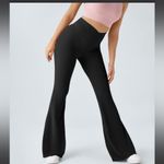 Halara  Crossover High Waisted Back Pocket Super Flare Leggings Photo 1