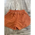 Alphalete  Woman’s Infinity Stride Short W/ Liner - Sour Tangerine, Size Medium Photo 7