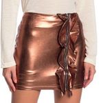 Line and Dot Gold Mini Pencil Skirt with Ruffled Detail Photo 0