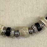 Vintage stone, metal and rhinestone beaded charms on black leather necklace Photo 1