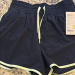 Athleta Navy Women's Shorts with Light Green Trim Photo 3