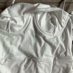 Ezra Revel Rey  one piece in iridescent white lurex Photo 1