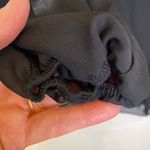 Women’s Black Sheer Flowy High Low Blouse Cut Out Back Sz Sm Elastic Cuffs Photo 1
